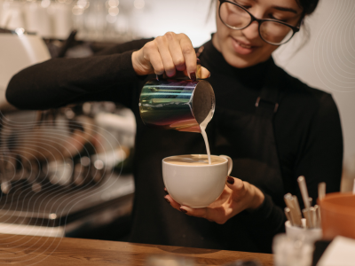 woman making coffee in one of Pataakhaa's best coffee mugs